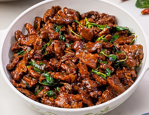 Authentic Thai Beef Pad Kra Pao served freshly made in a bowl