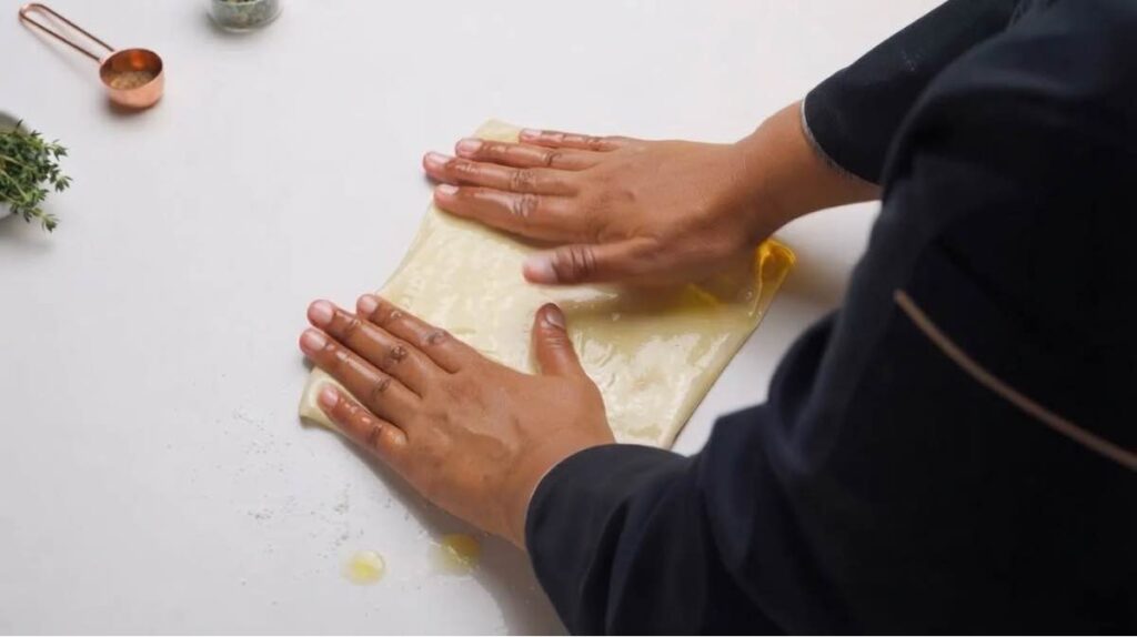 Turkish borek Re-stretching and folding the layered pastry square to build ultimate flakiness