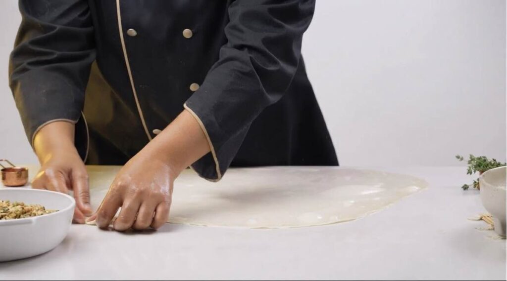 Turkish borek Re-stretching and folding the layered pastry square to build ultimate flakiness
