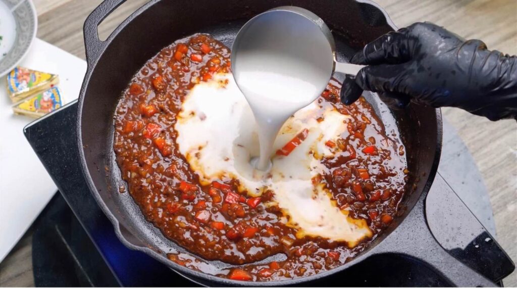 Make it creamy Heavy cream and cheese wedges poured into the simmering skillet sauce,